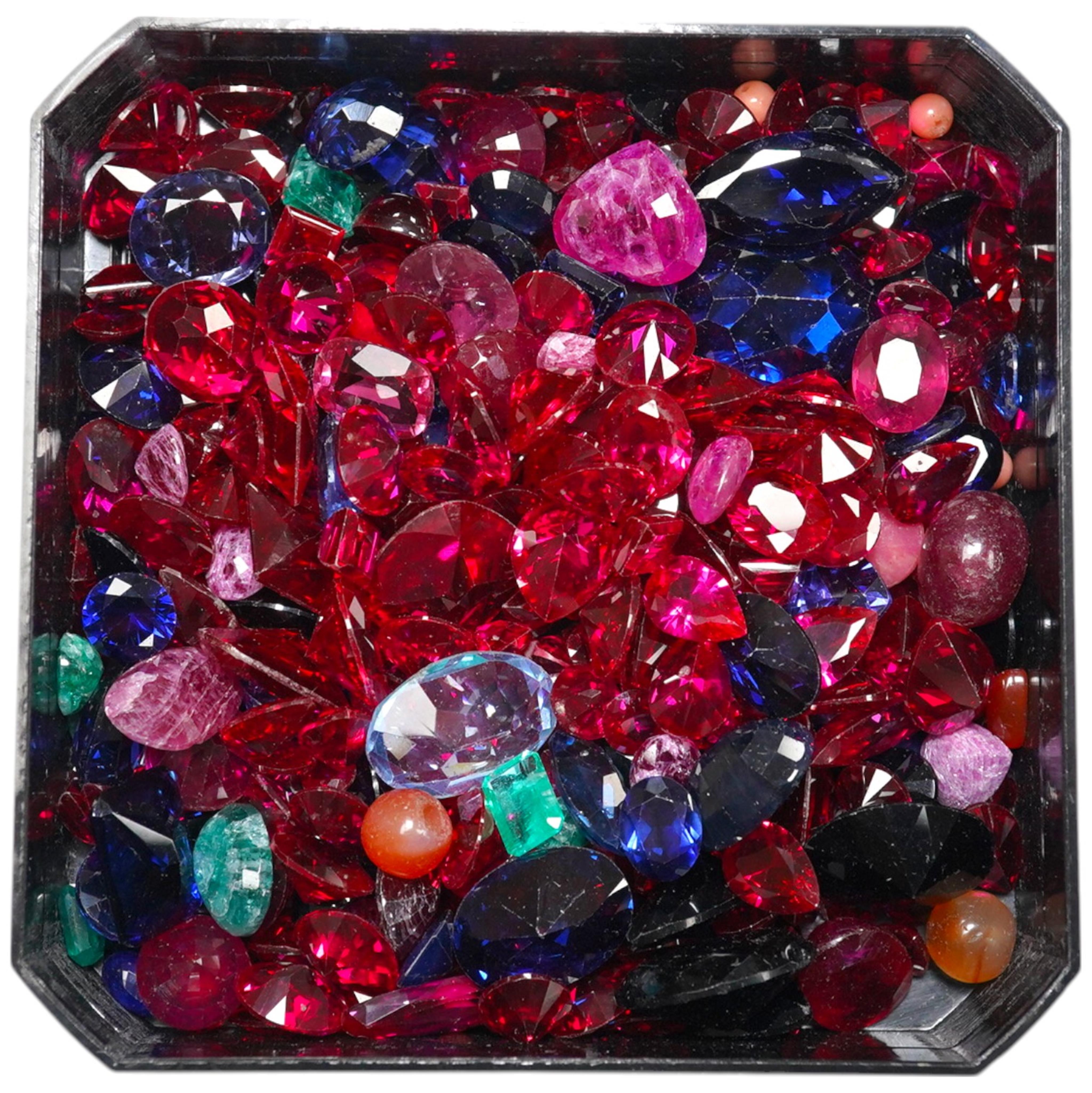 A quantity of assorted unmounted coloured gemstones. Condition - poor to fair